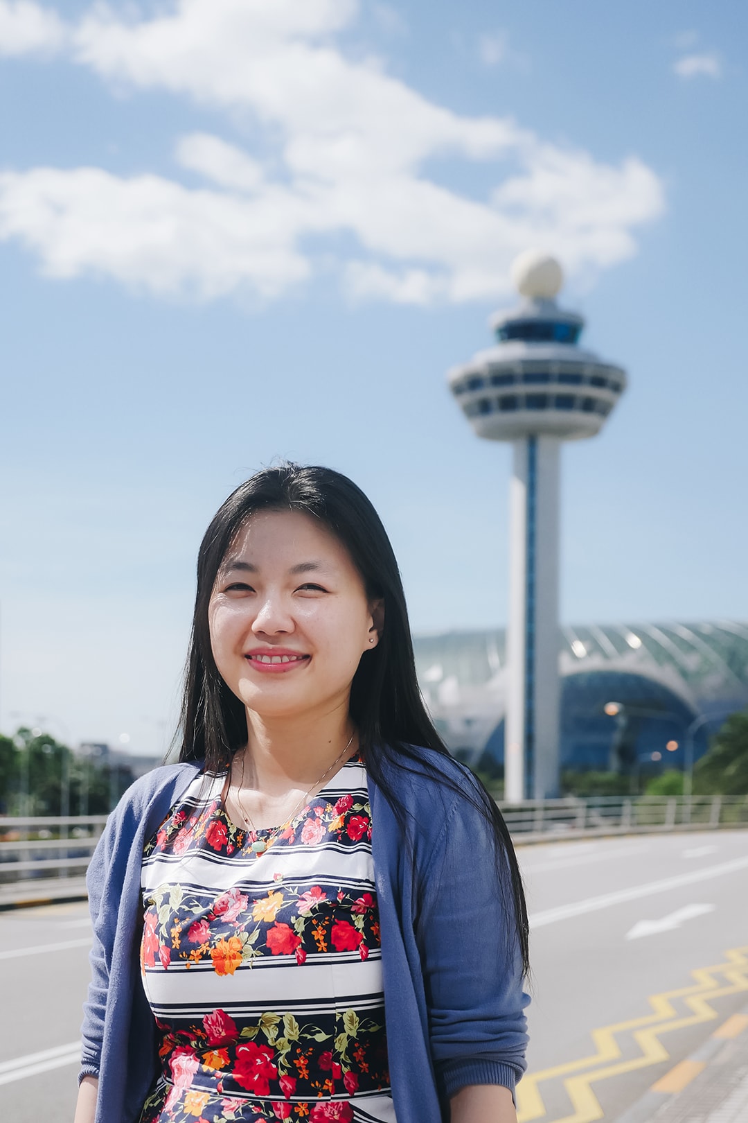 Sheena, with Changi Control Tower in the background