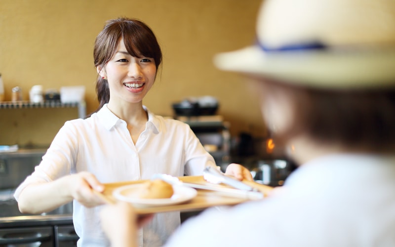 Coffee waitress smiling
