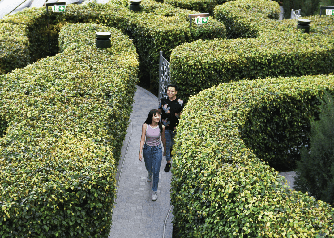 couple walking through hedge maze at changi airport in singapore