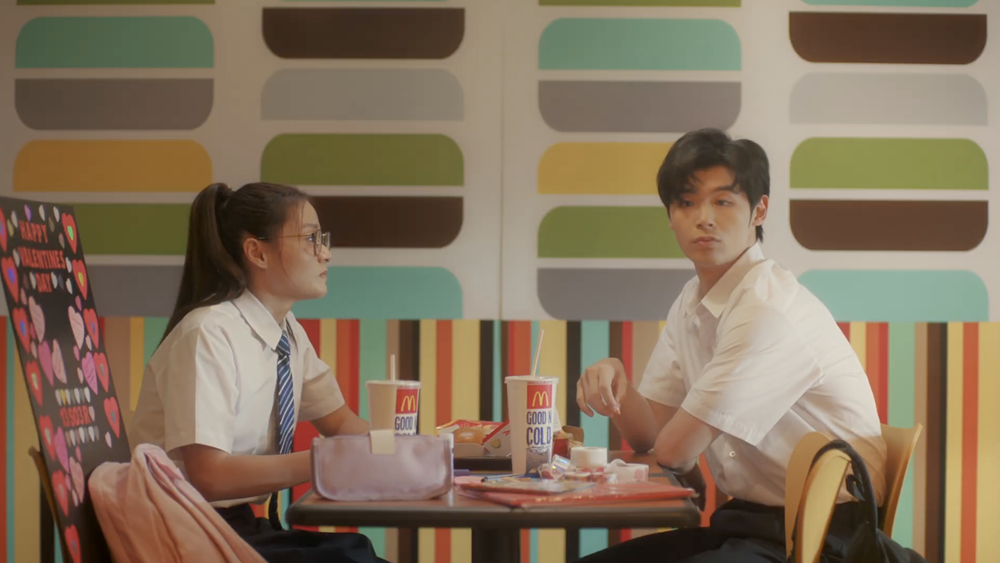 Both leads, dressed in their junior college uniforms, sharing a meal at the iconic McDonald’s at Terminal 2.