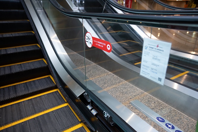 A wide shot of an escalator