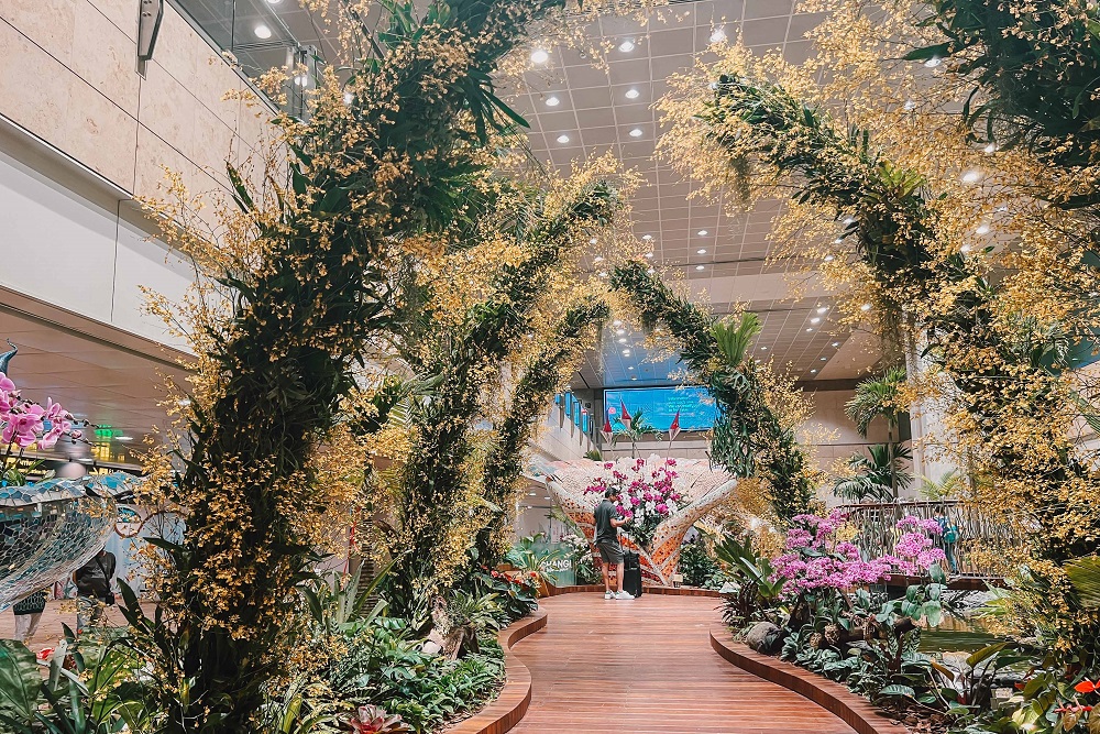 Plant arches and orchid blooms at the Enchanted Garden at level 2.