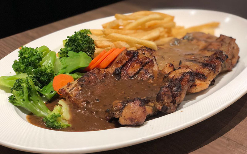 Andes by Aston’s Double Up Chicken, served with vegetables and fries. 