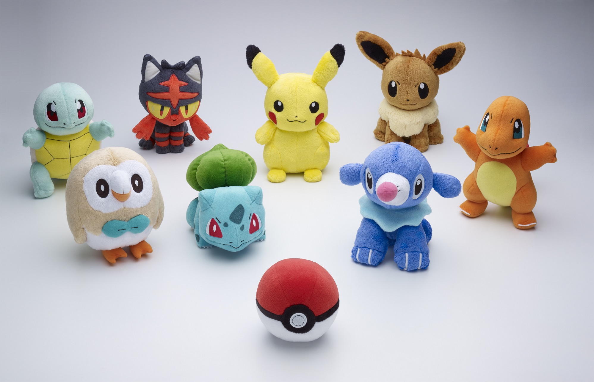 Nine pokemon plush toys lined up 