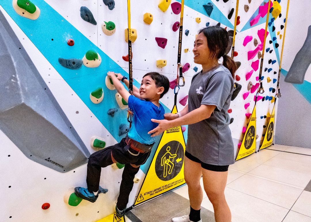 child climbing wall at changi airport t3 during private kids party 