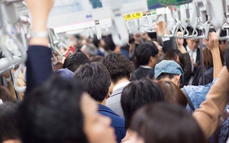 Commuters in a packed subway, Japan