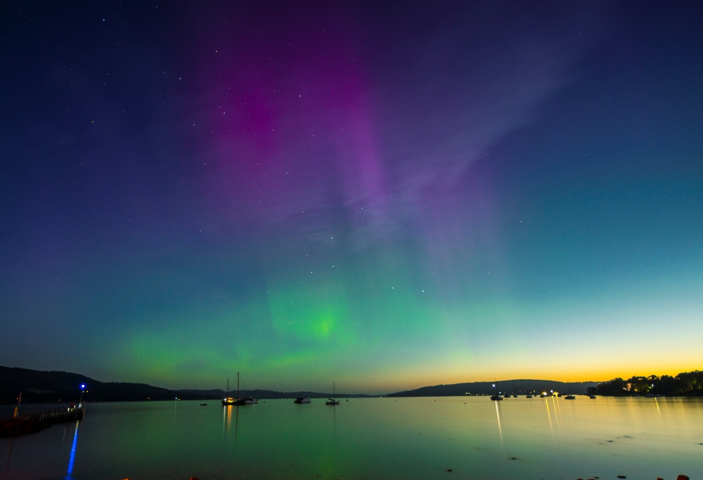 The southern lights adorn the skies above the outskirts of Hobart in Tasmania