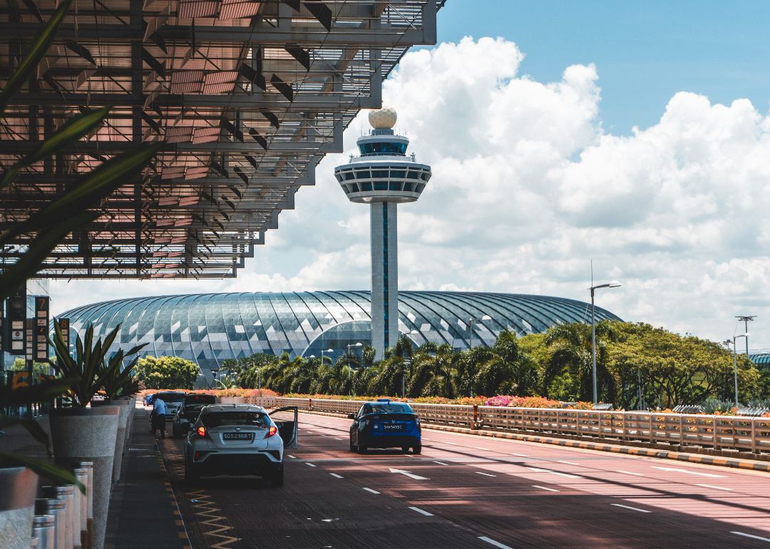 travellers arriving at singapore airport in taxis for their codeshare flight