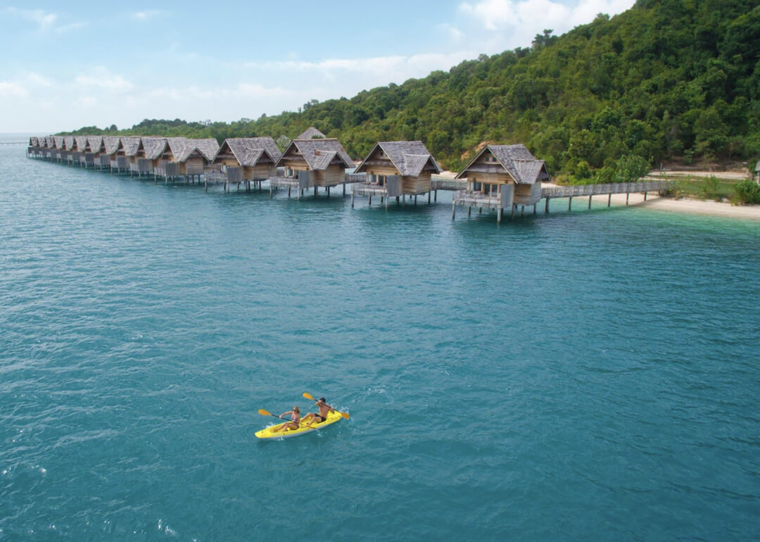 A row of over-the-water villas built out of wooden planks