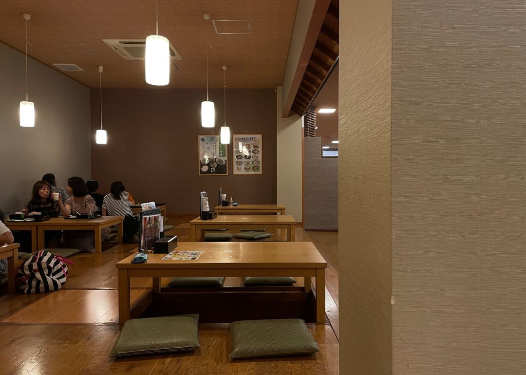 tables and floor seats in a rest area in hananoyu onsen in kyoto
