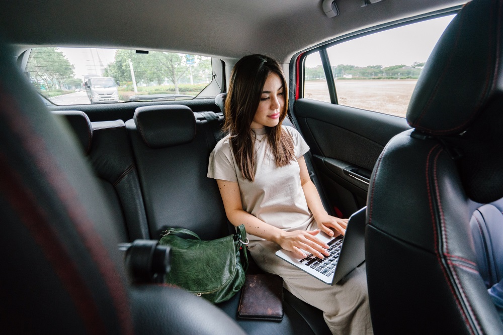 A business traveller in a vehicle