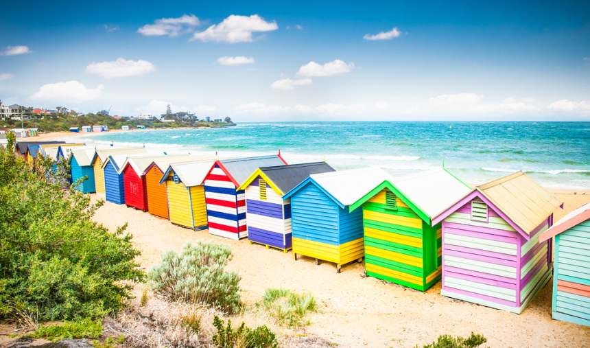 A row of colourful bathing houses along a beach at Melbourne