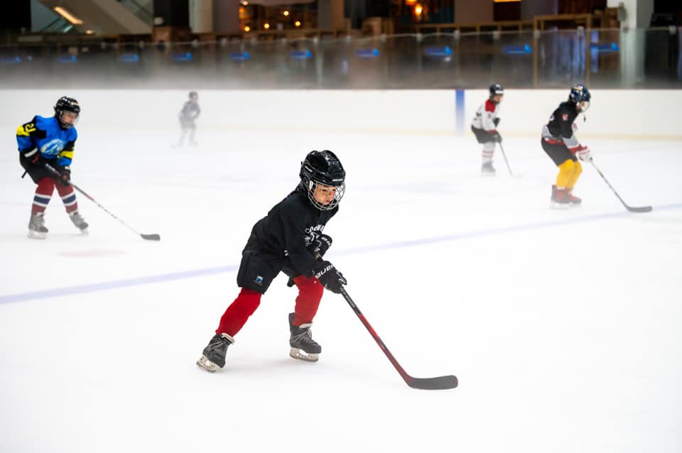 kids playing an ice hockey match at the rink located at jcube, south west of singapore