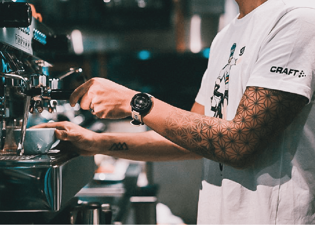 barista preparing a cup of chai latte at bicycle themed study cafe in singapore