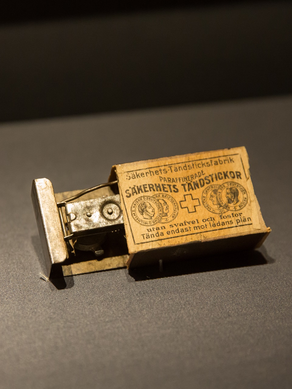 the morse code device in a matchbox used by prisoners to transmit messages, exhibited at changi museum singapore