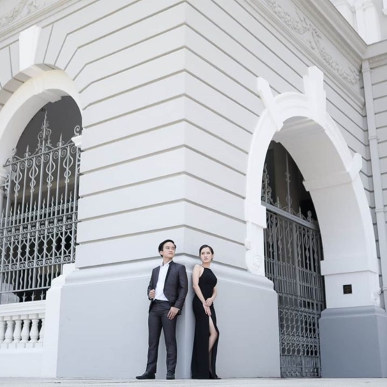 Couple posing by the corner of Victoria Theatre & Concert Hall