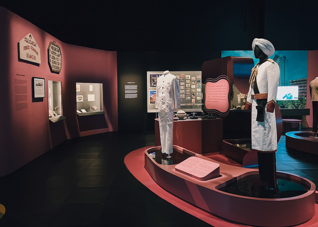 exhibit display of two uniforms from raffles hotel displayed at the national museum of singapore travel exhibition